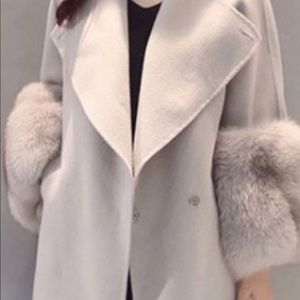 Light grey car length coat.